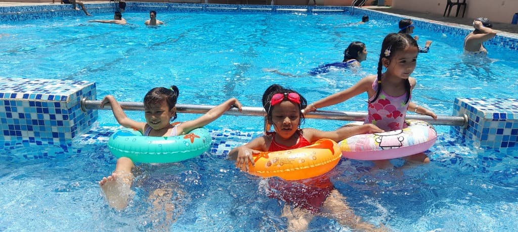 Nursery students enjoying swimming activities